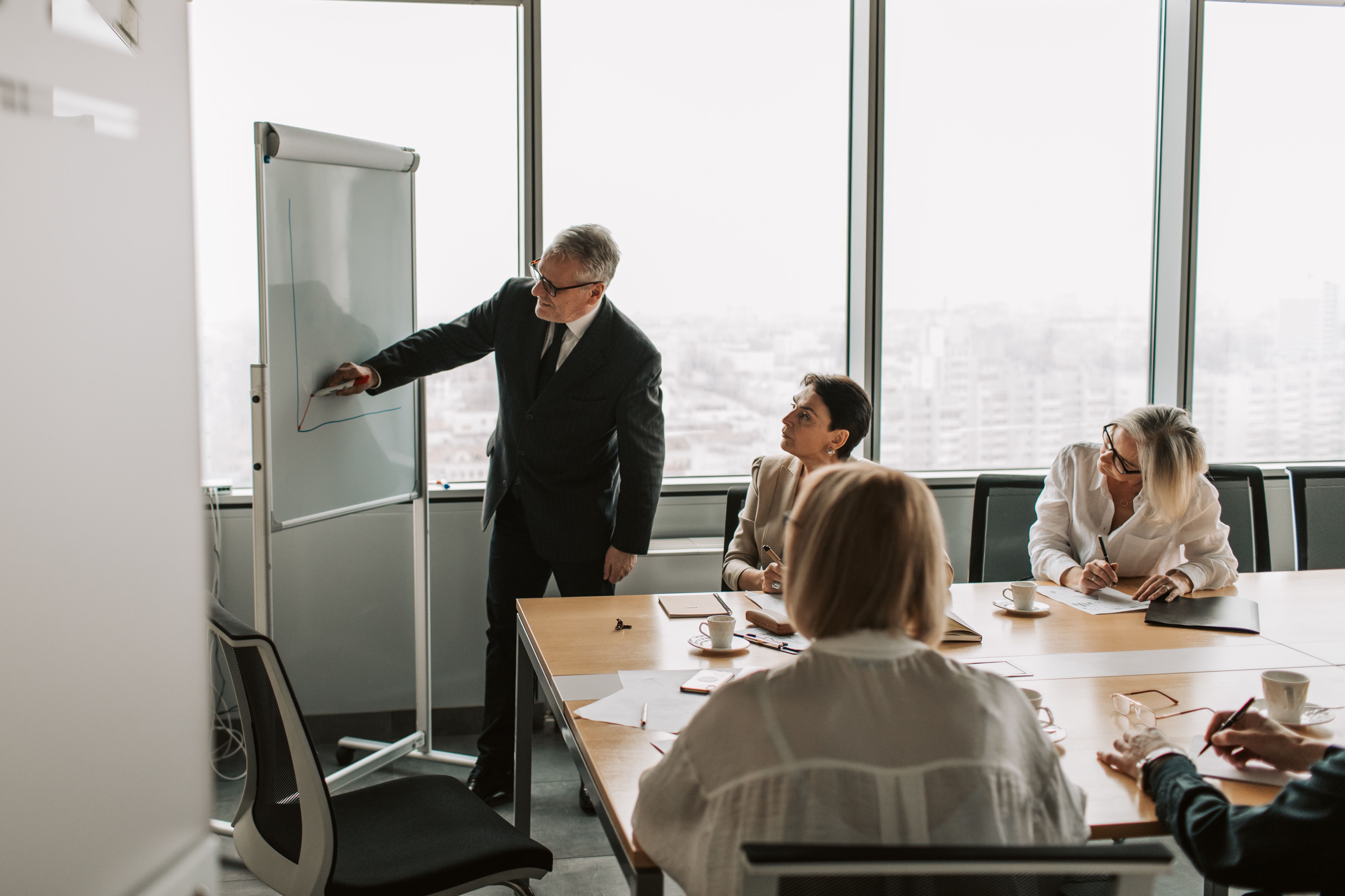 A collaborative planning conversation at a whiteboard